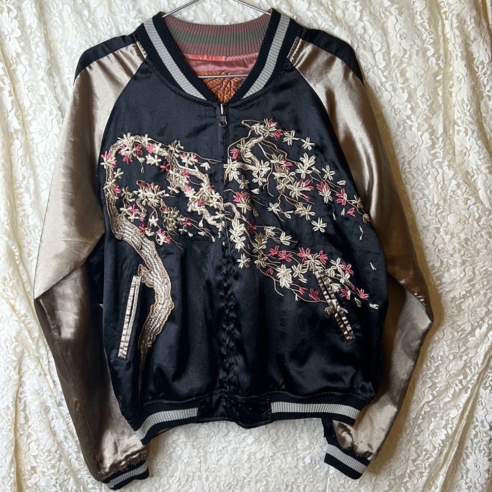 Reversible embroidered bomber jacket.